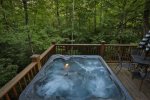 Relax in the hot tub that comfortably seats 4